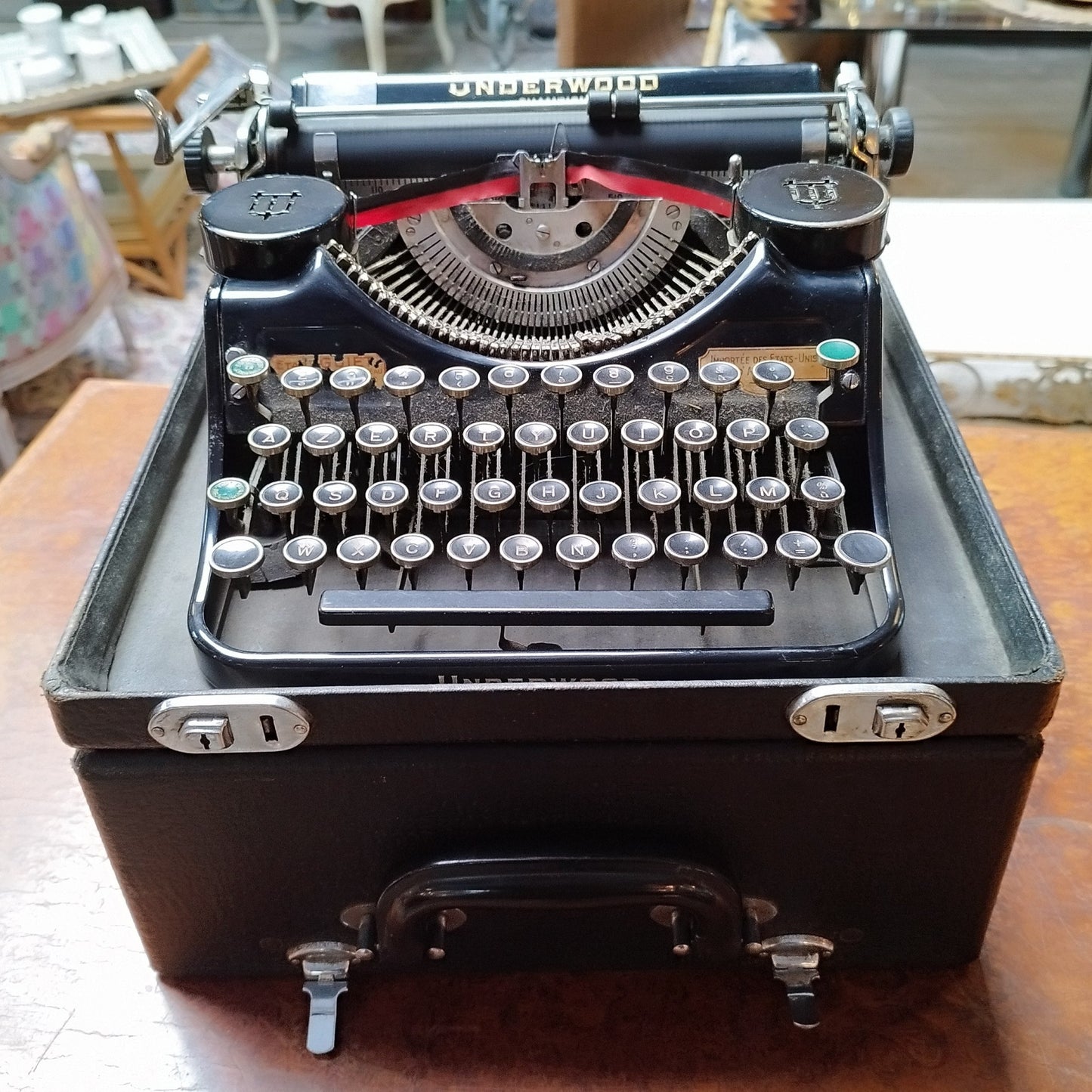 Machine à écrire de marque Underwood modèle Champion